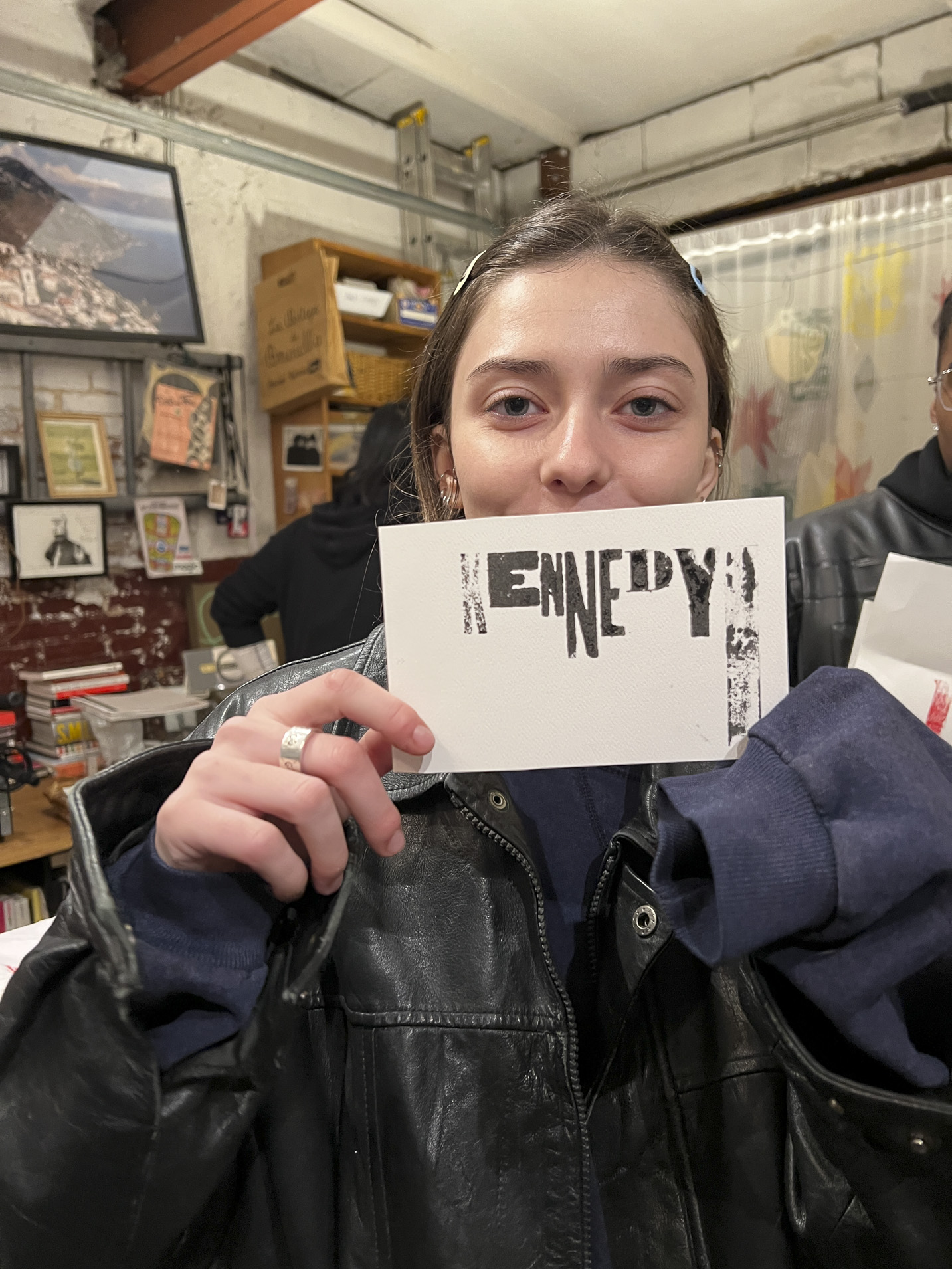 Tisch student holding a print made with hand-set type